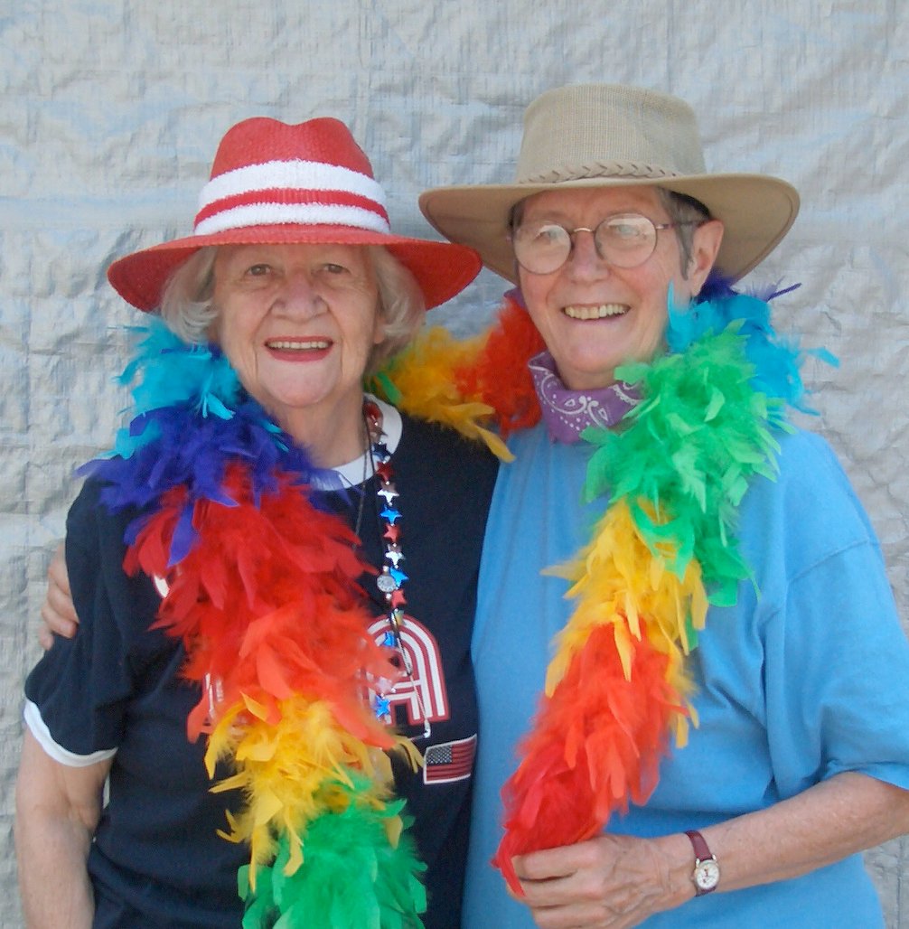 Barbara Lindquist and Jeanne Arnold celebrating and promoting Mother Courage Press at a Gay Pride event in 1999.